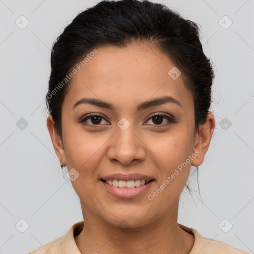 Joyful latino young-adult female with short  brown hair and brown eyes