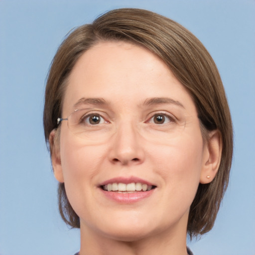 Joyful white adult female with medium  brown hair and grey eyes