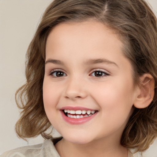 Joyful white child female with medium  brown hair and brown eyes