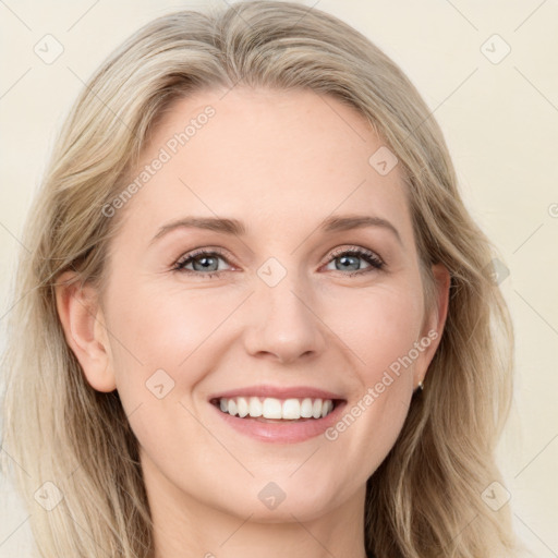 Joyful white young-adult female with long  brown hair and blue eyes