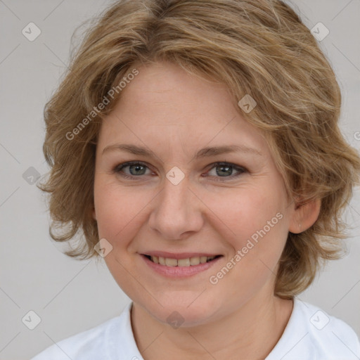 Joyful white young-adult female with medium  brown hair and blue eyes