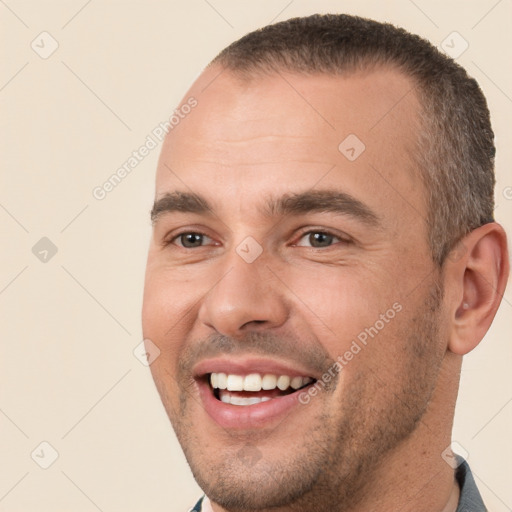 Joyful white young-adult male with short  brown hair and brown eyes