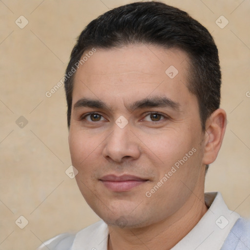 Joyful white young-adult male with short  black hair and brown eyes