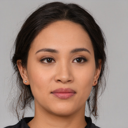 Joyful white young-adult female with medium  brown hair and brown eyes