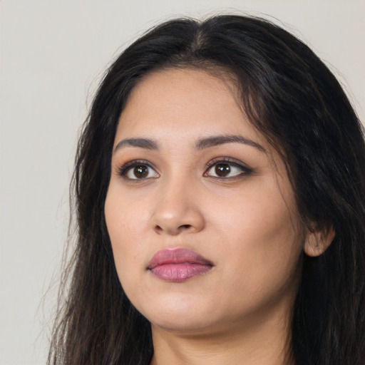 Neutral white young-adult female with long  black hair and brown eyes