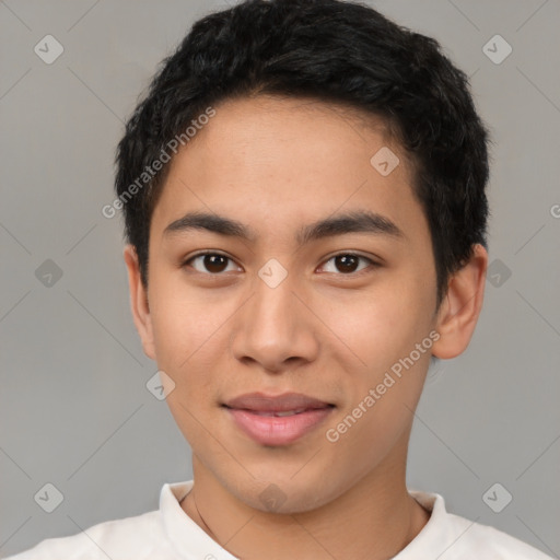 Joyful latino young-adult male with short  brown hair and brown eyes