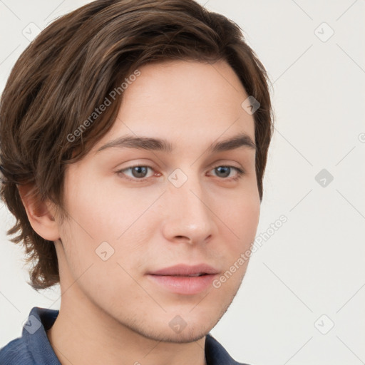 Neutral white young-adult male with short  brown hair and grey eyes