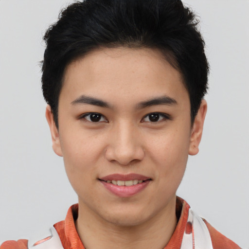 Joyful asian young-adult female with short  brown hair and brown eyes