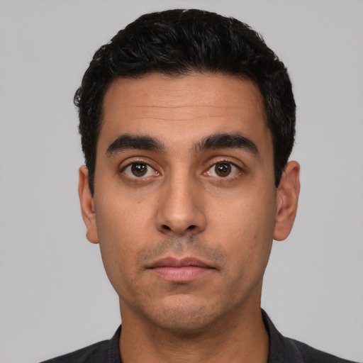 Neutral latino young-adult male with short  black hair and brown eyes