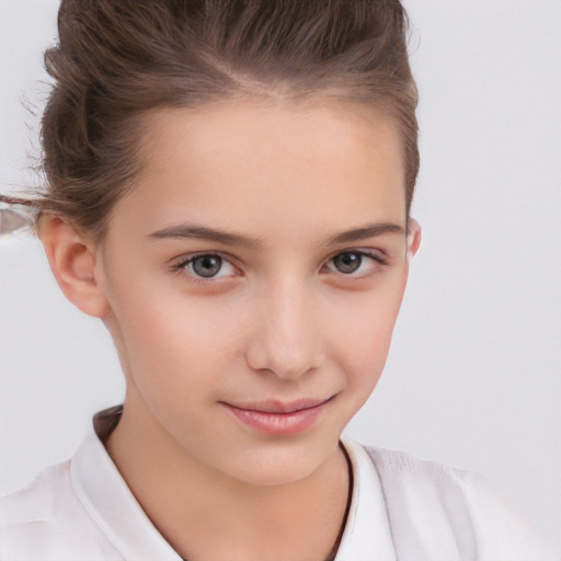 Joyful white child female with short  brown hair and brown eyes