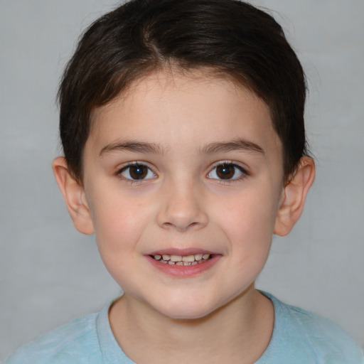 Joyful white child female with short  brown hair and brown eyes