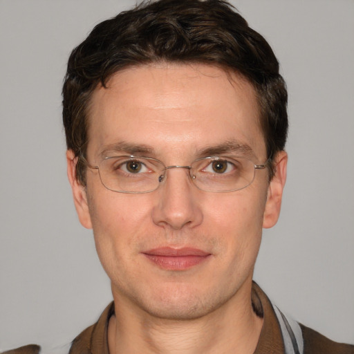 Joyful white adult male with short  brown hair and brown eyes