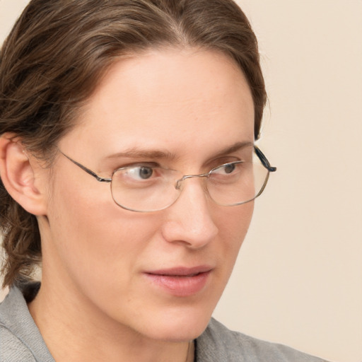 Neutral white young-adult female with medium  brown hair and grey eyes