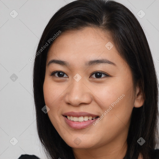 Joyful asian young-adult female with long  brown hair and brown eyes