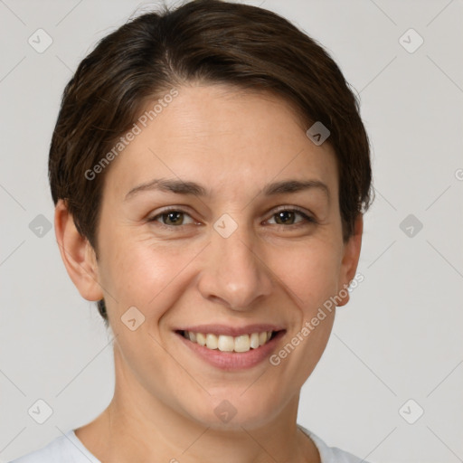 Joyful white adult female with short  brown hair and brown eyes