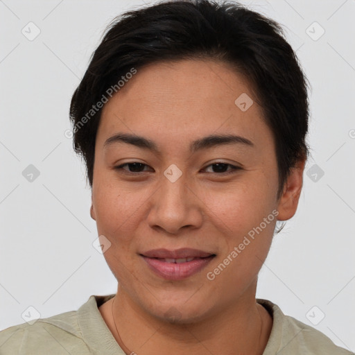 Joyful asian young-adult female with short  brown hair and brown eyes