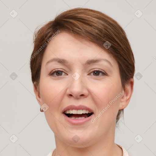 Joyful white adult female with short  brown hair and brown eyes