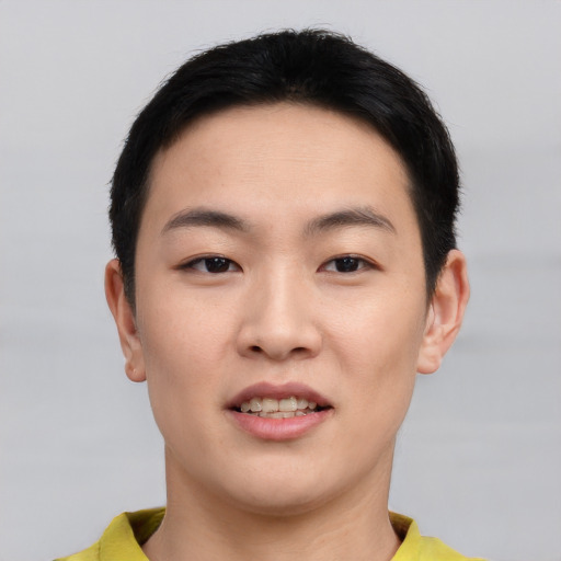 Joyful asian young-adult male with short  black hair and brown eyes