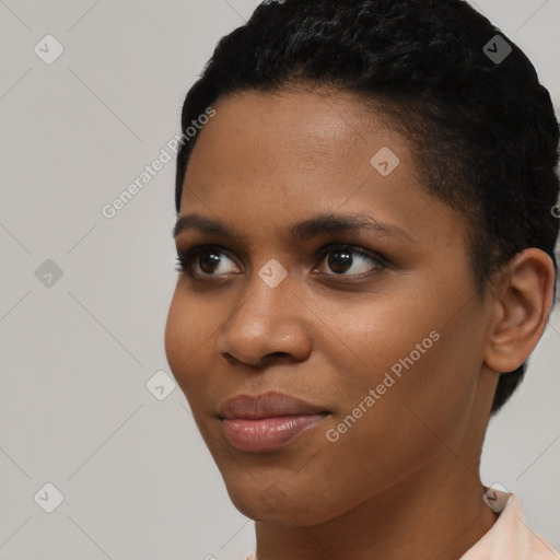 Joyful black young-adult female with short  brown hair and brown eyes