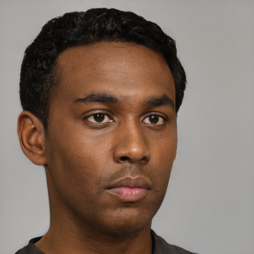 Neutral black young-adult male with short  black hair and brown eyes