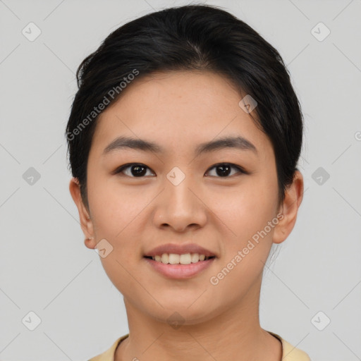 Joyful asian young-adult female with short  brown hair and brown eyes