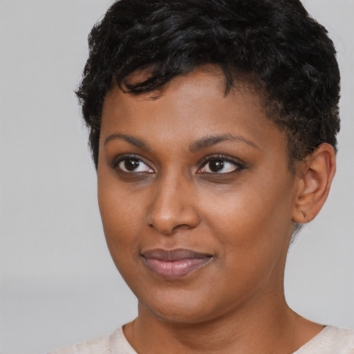 Joyful latino young-adult female with short  black hair and brown eyes