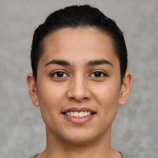 Joyful latino young-adult female with short  brown hair and brown eyes