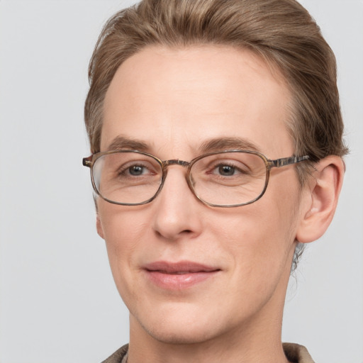 Joyful white adult male with short  brown hair and grey eyes