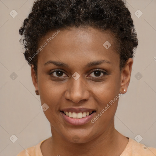 Joyful black young-adult female with short  brown hair and brown eyes