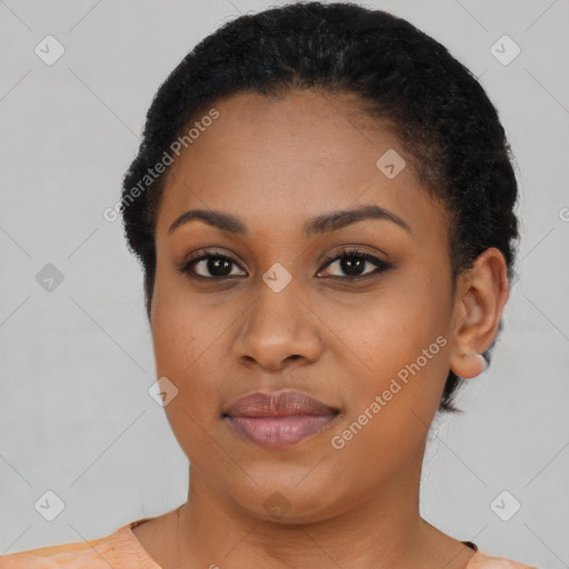 Joyful black young-adult female with short  black hair and brown eyes