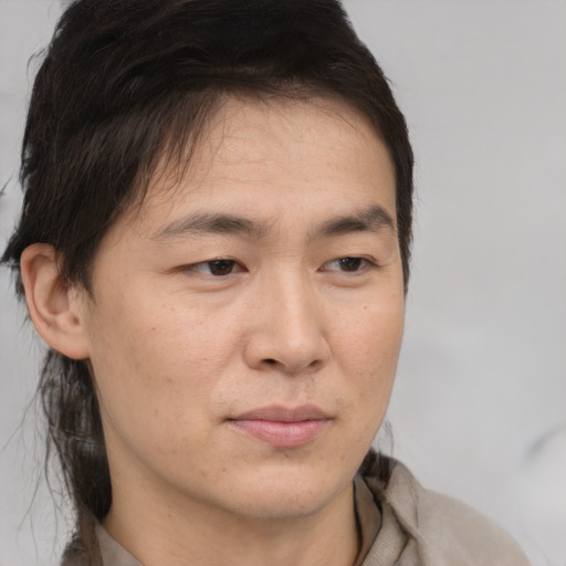 Neutral asian young-adult male with medium  brown hair and brown eyes