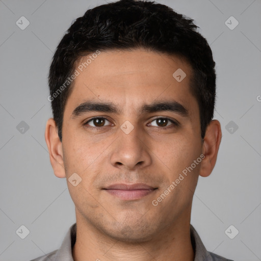 Joyful white young-adult male with short  black hair and brown eyes