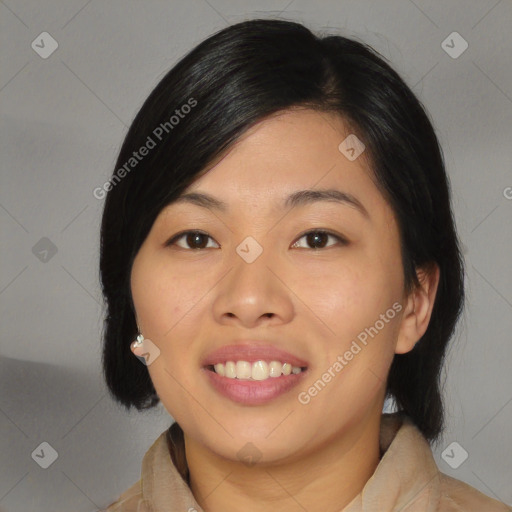 Joyful asian young-adult female with medium  black hair and brown eyes