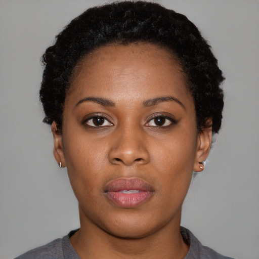 Neutral black young-adult female with short  black hair and brown eyes