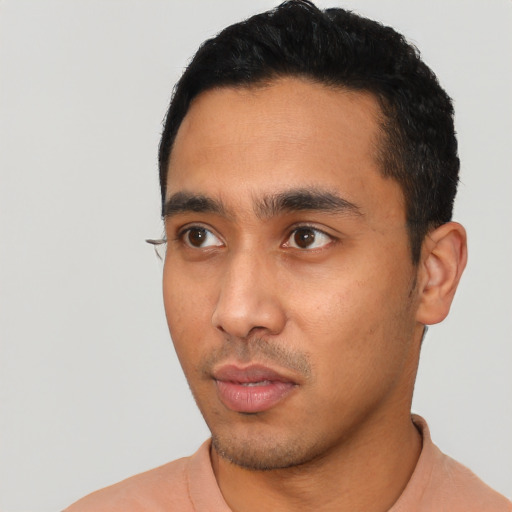 Neutral latino young-adult male with short  black hair and brown eyes