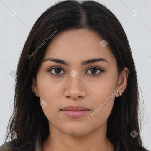 Joyful latino young-adult female with long  brown hair and brown eyes