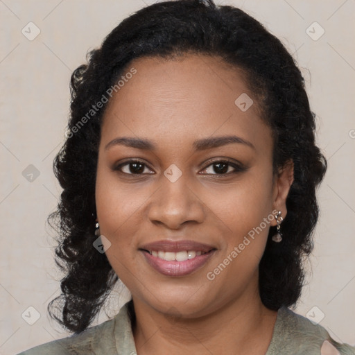 Joyful black young-adult female with long  black hair and brown eyes