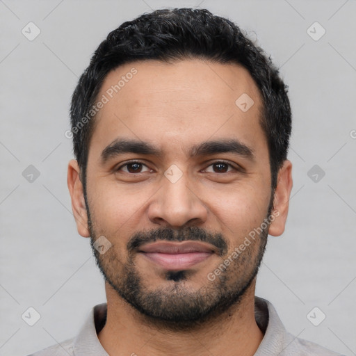 Joyful latino young-adult male with short  black hair and brown eyes