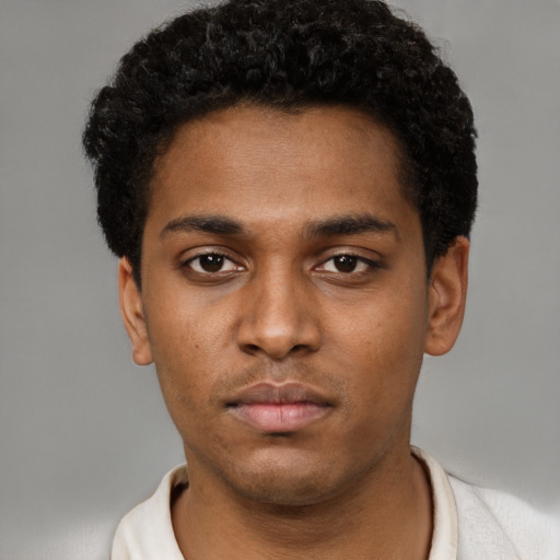 Neutral black young-adult male with short  brown hair and brown eyes