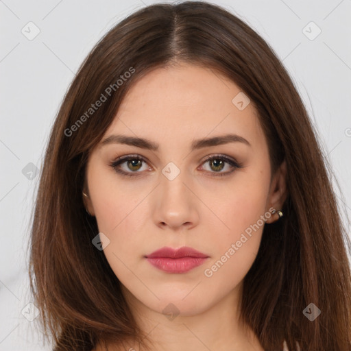 Neutral white young-adult female with long  brown hair and brown eyes