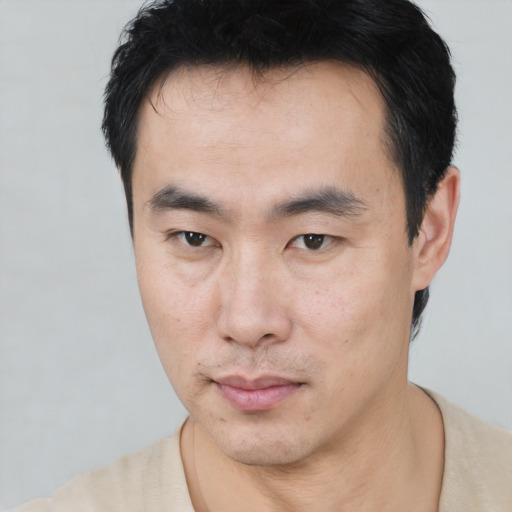 Neutral asian young-adult male with short  black hair and brown eyes