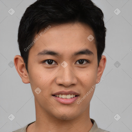 Joyful asian young-adult male with short  black hair and brown eyes