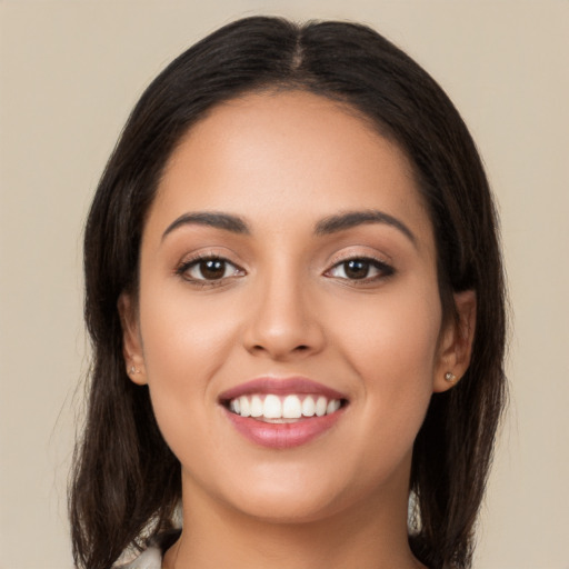 Joyful white young-adult female with long  brown hair and brown eyes