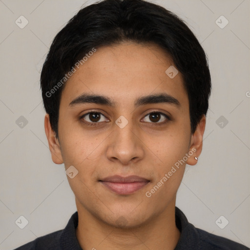 Joyful latino young-adult male with short  black hair and brown eyes