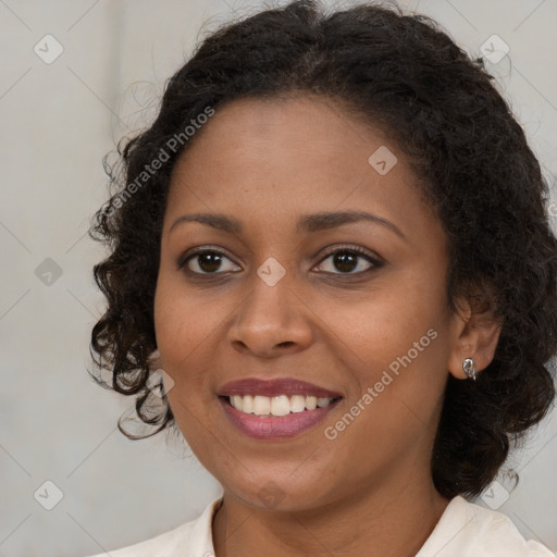 Joyful black young-adult female with medium  brown hair and brown eyes