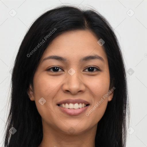 Joyful latino young-adult female with long  brown hair and brown eyes