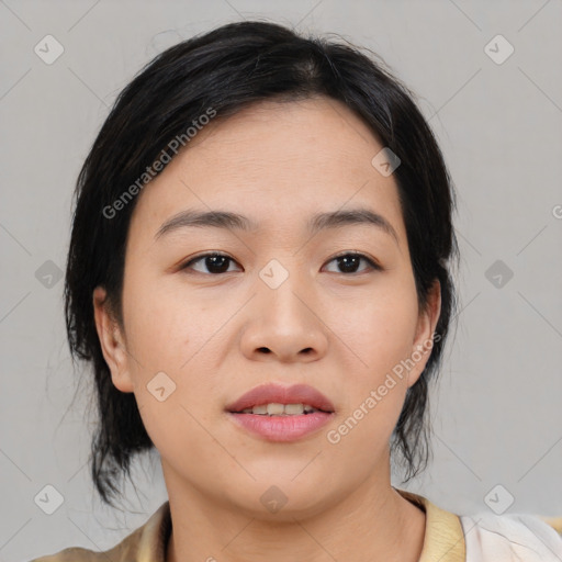 Joyful asian young-adult female with medium  black hair and brown eyes