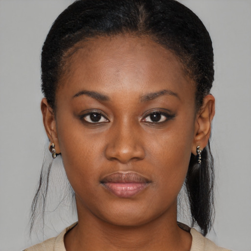 Neutral black young-adult female with medium  brown hair and brown eyes