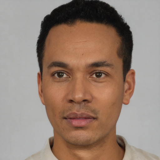Neutral latino young-adult male with short  black hair and brown eyes