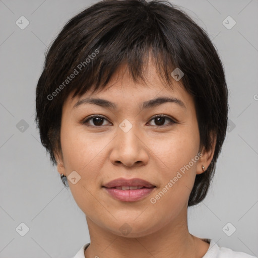 Joyful asian young-adult female with medium  brown hair and brown eyes